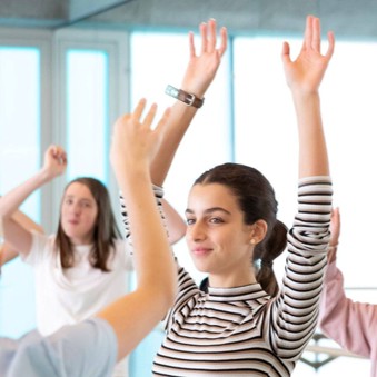 Young people with arms in the air