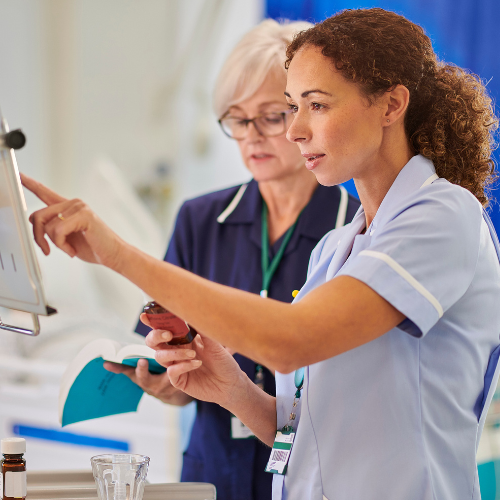 Nurses looking at chart