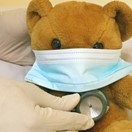 picture of a toy bear with a mask on