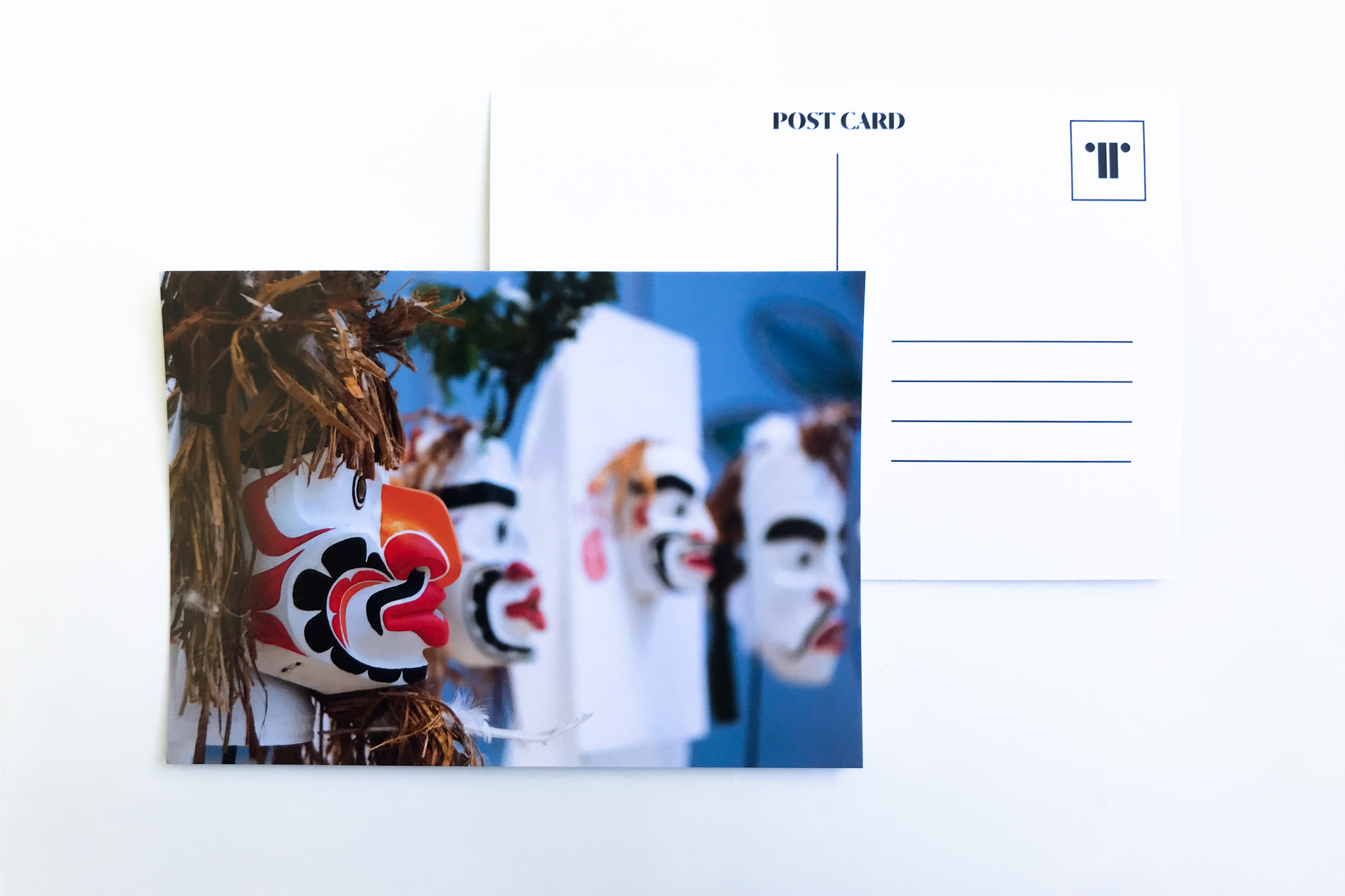 A5 postcard with image of Atlakim masks displayed during 'Pine's Eye'.