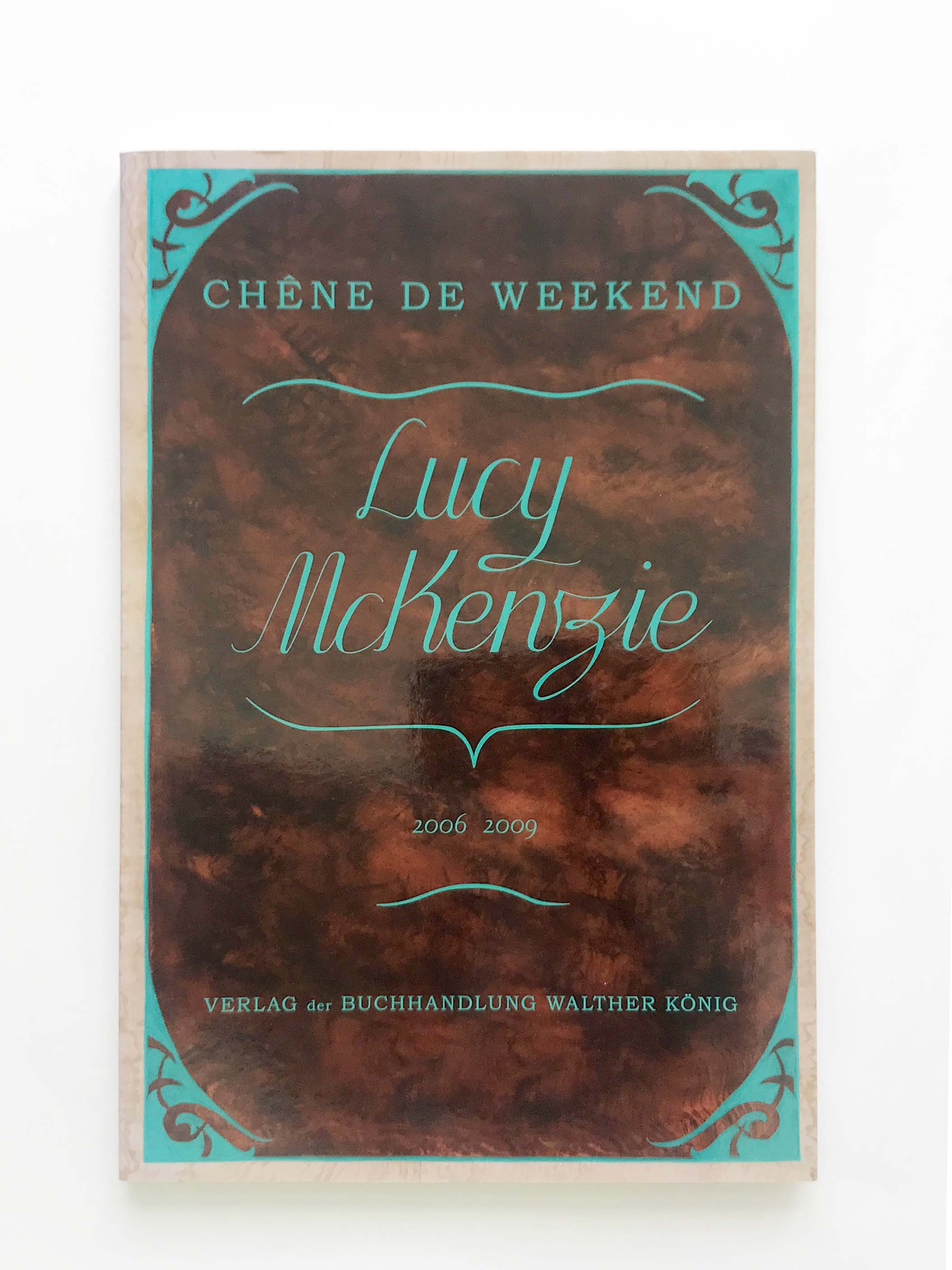 Lucy McKenzie's book, brown cover with teal decoration