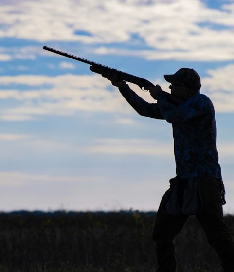 Man holding a stick in the air