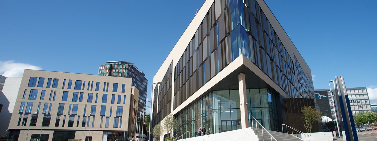 Exterior of TIC building with blue sky background