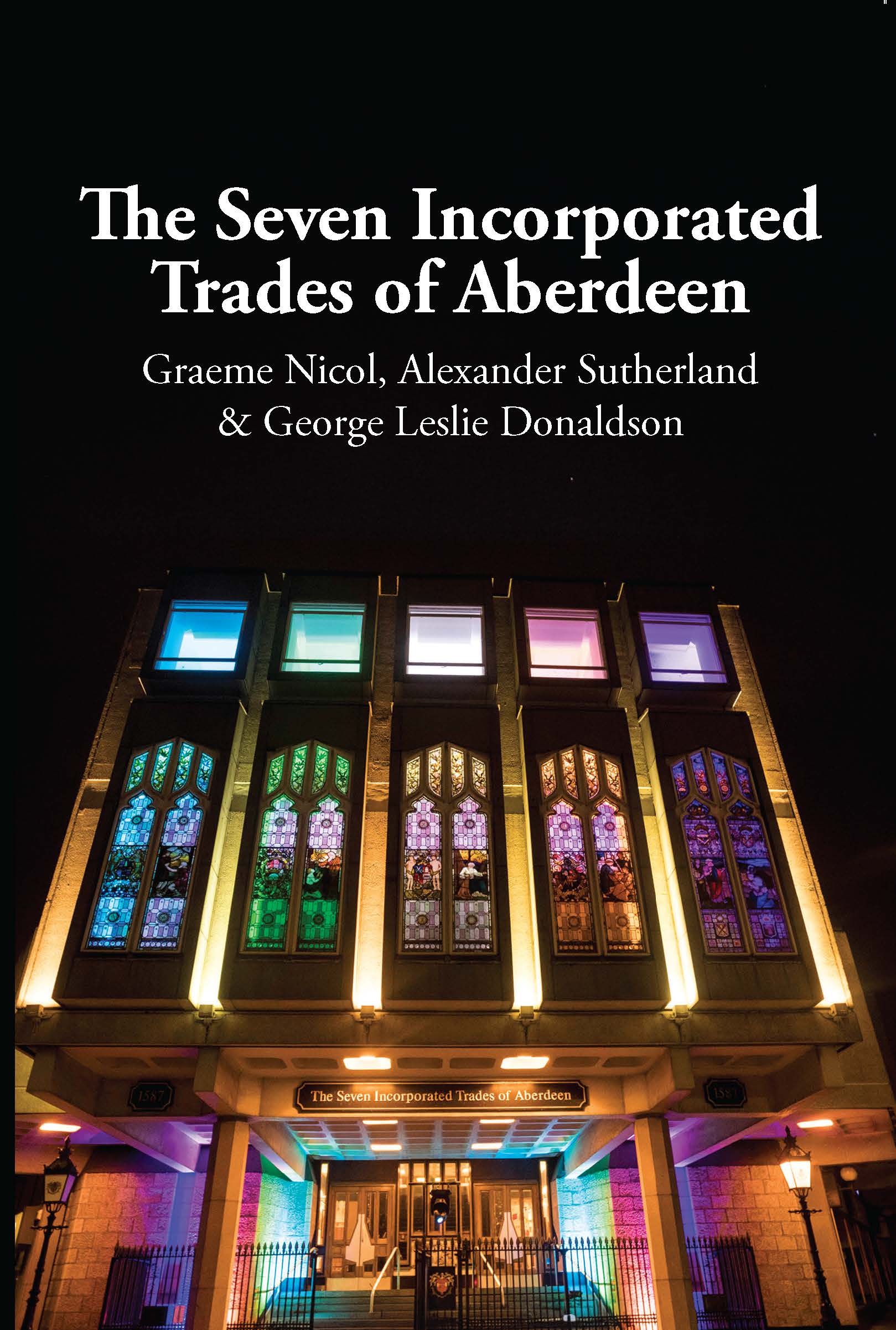 Cover showing night time image of new Trades building on Holborn Street, illuminated by different colour lights