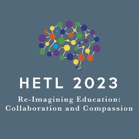 HETL Logo - a white sphere, with two blue strips across the centre. The word HETL in blue at the top
