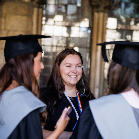 Students wearing graduation gowns and mortar boards