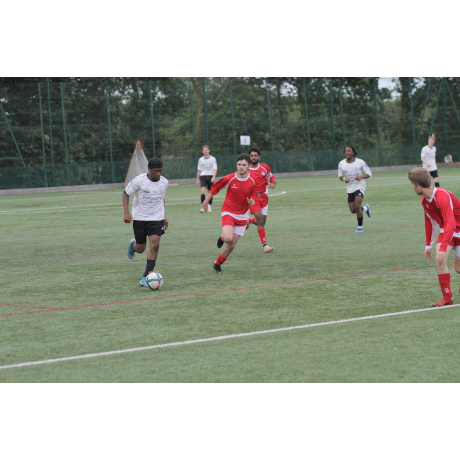 Football match, a team in white and a team in red
