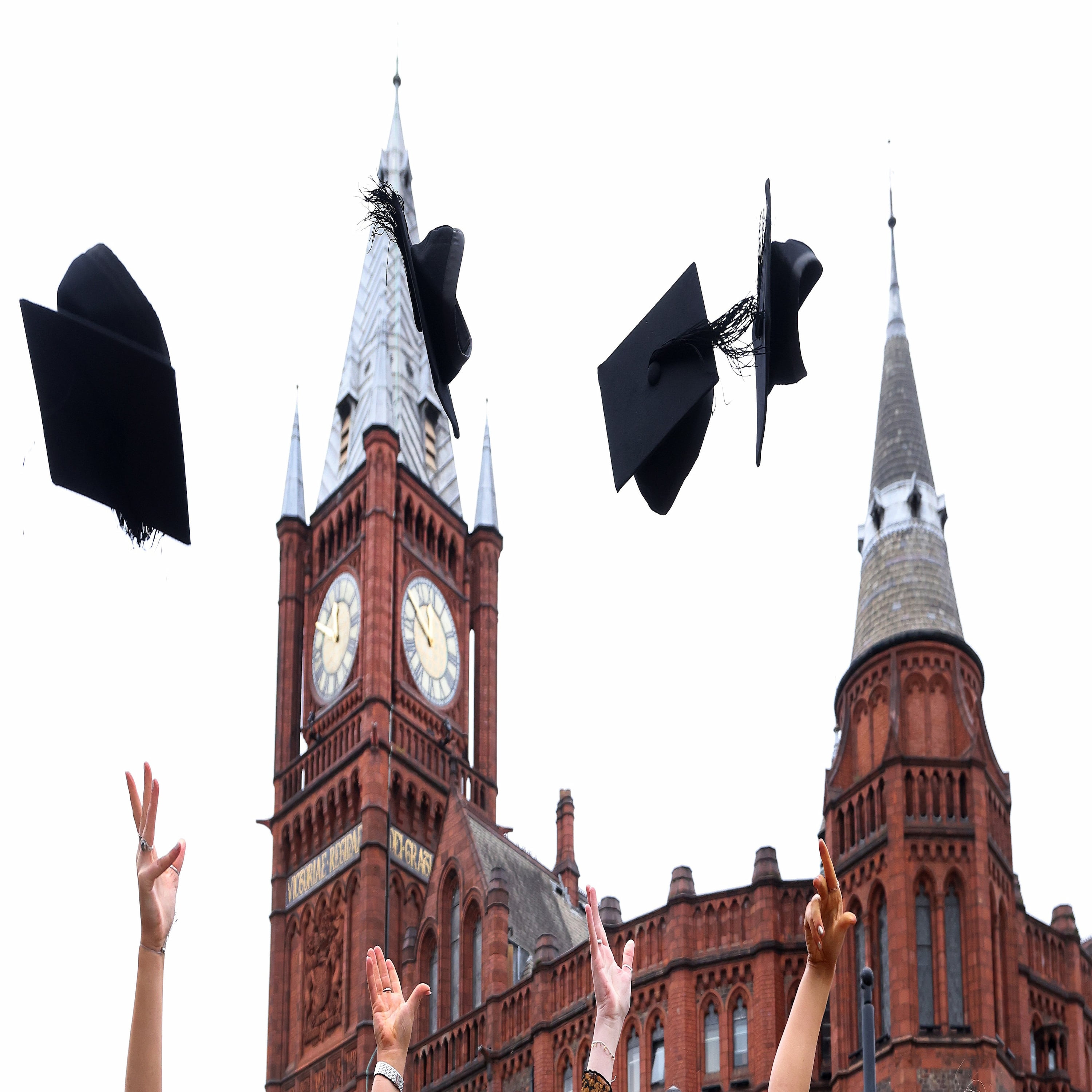 Graduation Caps being thrown in the air