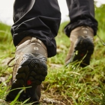 close up of walking boots on a grass path