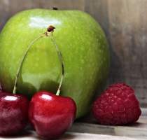 Green apple, red cherries and raspberries