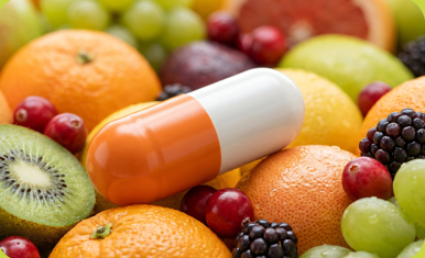 Fresh fruit with orange and white capsule