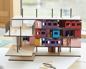 An architectural model of a building on a table