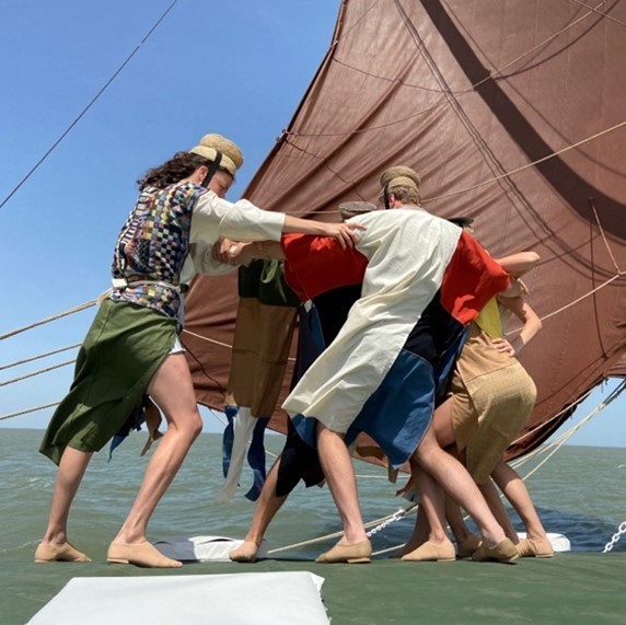 Three sailors on a boat