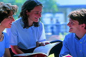 Students discussing a document