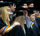 DMU Graduants Robed with DMU colours.