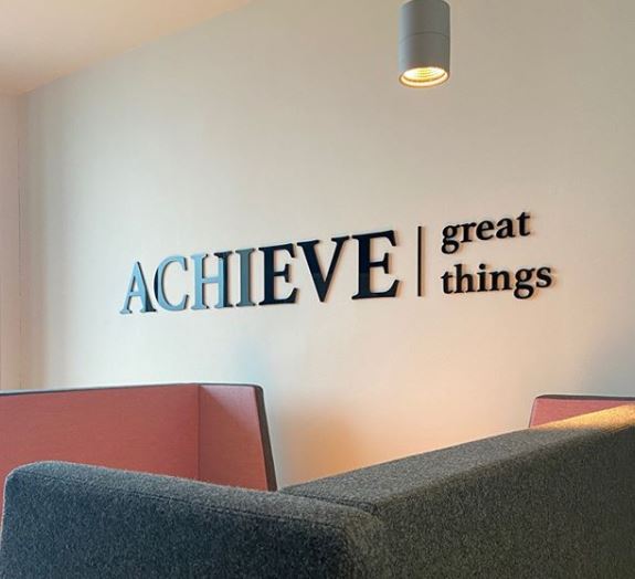 Achieve Great Things sign on Bristol Business School wall