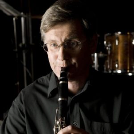 Man in glasses playing clarinet