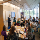 A training room with staff member delivering to participants