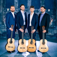 image of four guitarists holding their guitars on blue background interior of chapel
