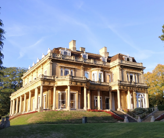 a picture of headington hill hall on a sunny day