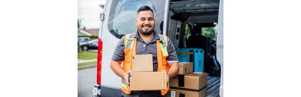 image of a delivery driver holding packages