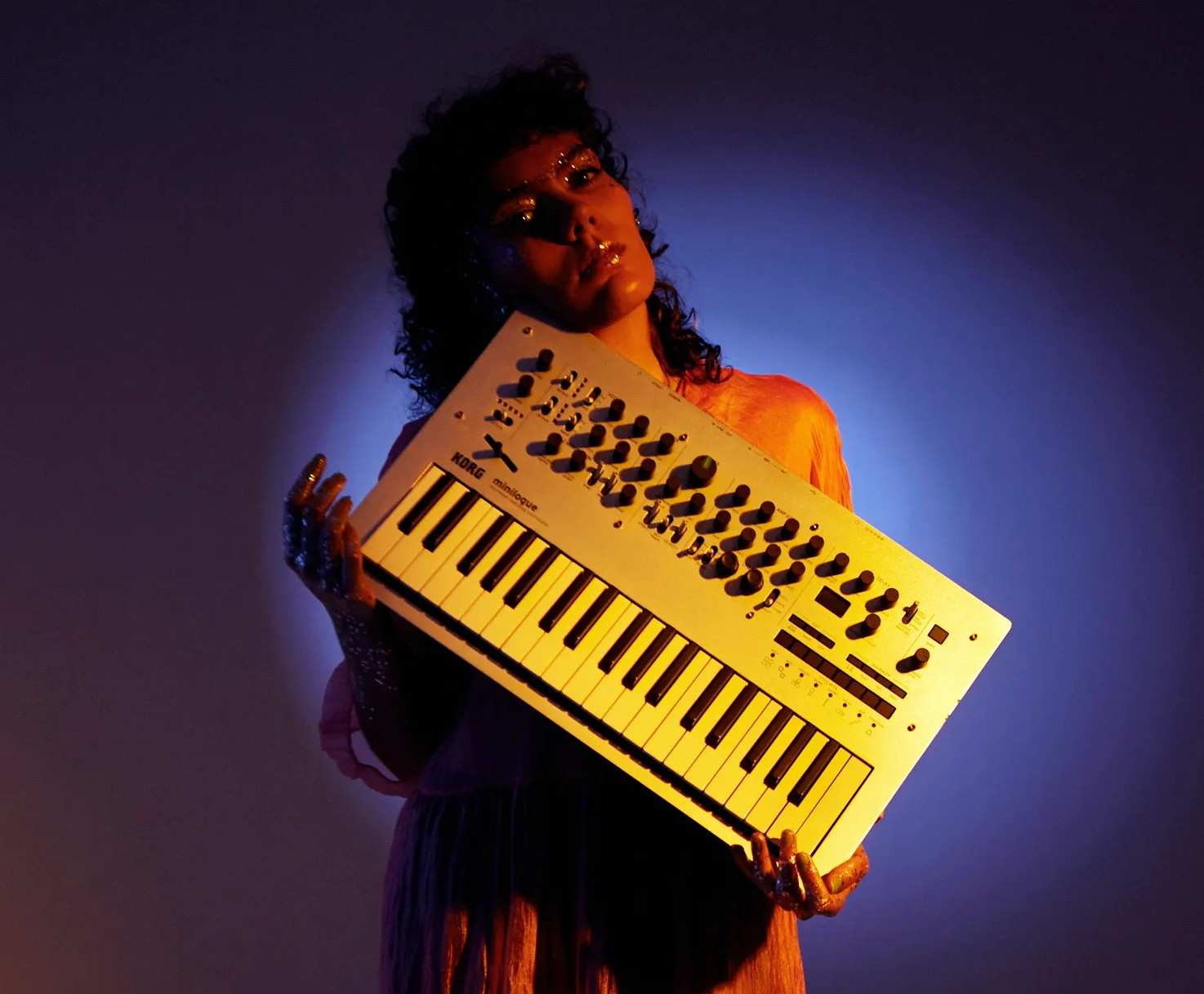Montanera a musician with her Korg synthesizer