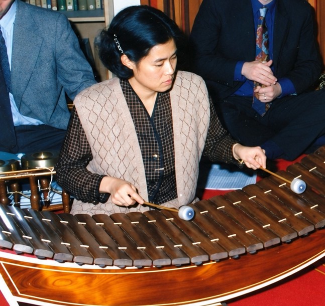 Woman playing thai instrumen