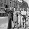 an image of people on the street in black and white