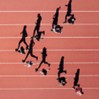 Top down of people running on a track field in a v shape
