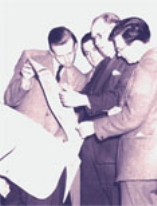 Men examining parchment roll