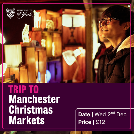 Image of 2 men viewing a stall at a Christmas Market
